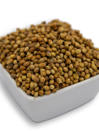 A white bowl filled with coriander seeds, showcasing their smooth texture and deep color.