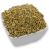 A white bowl filled with fennel seeds, showcasing their smooth texture.