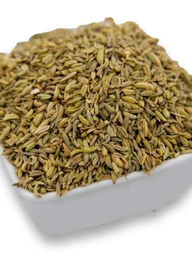 A white bowl filled with fennel seeds, showcasing their smooth texture.