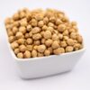 A white bowl filled with chick peas, showcasing their round shape and beige color.