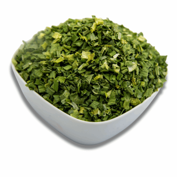A white bowl filled with dried chives, showcasing their vibrant green color and texture.