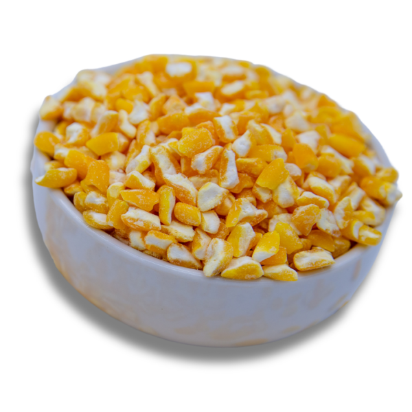 A white bowl filled with golden hominy corn, showcasing its unique texture and bright golden color.