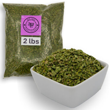  vibrant green bowl filled with dried coriander leaves, showcasing their rich color and natural texture.